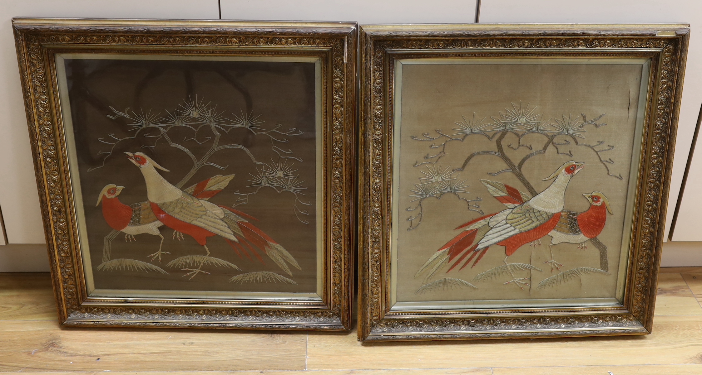 A pair of Japanese bird wool works in painted gilt frames